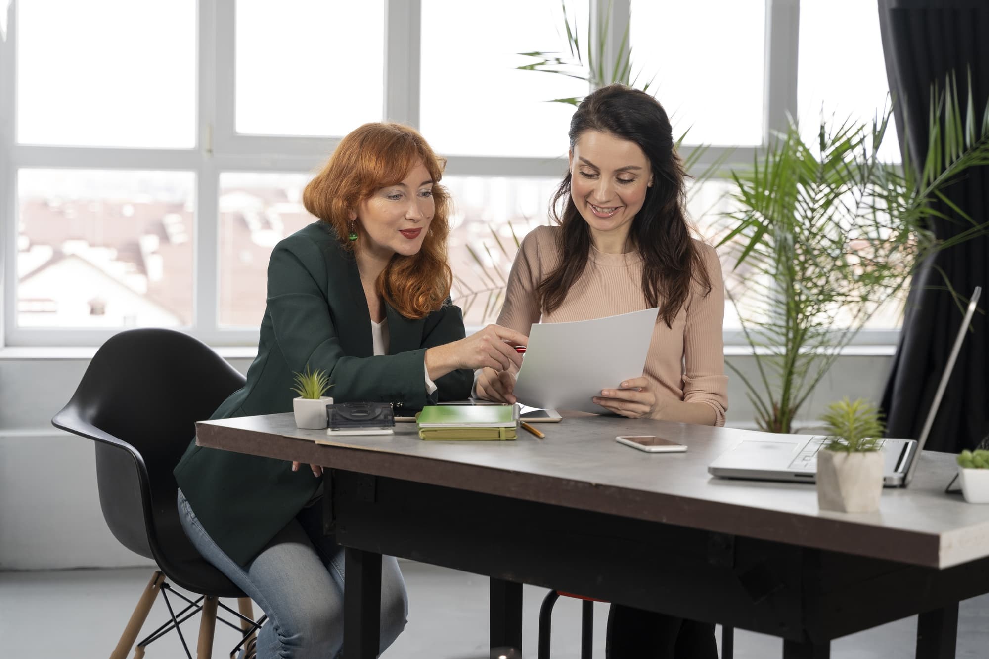 Two women having a discussion in an office